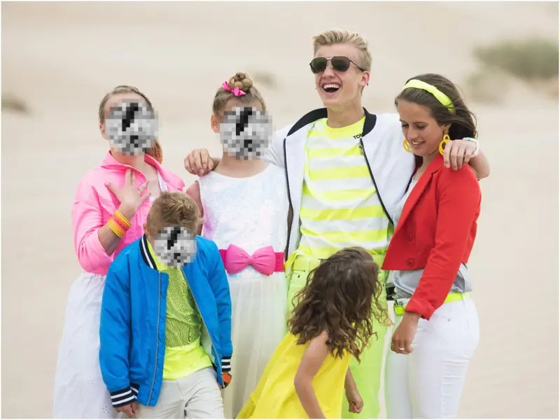 Ruby Franke’s six children, including Chad Franke and Shari Franke, posing in bright outfits in a desert. Faces of the four youngest children are blurred for privacy.