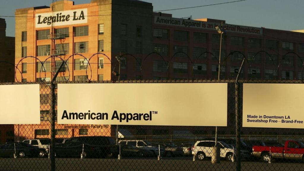 American apparel billboard in front of factory that says legalize LA